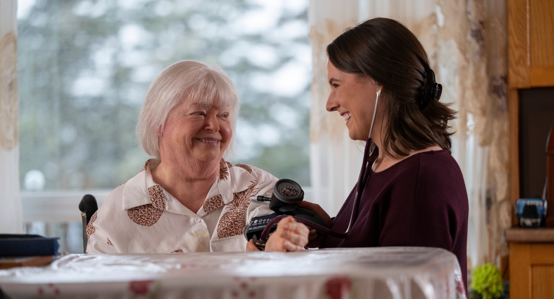 Dr. Robyn Pierce with a patient in the patient's home,