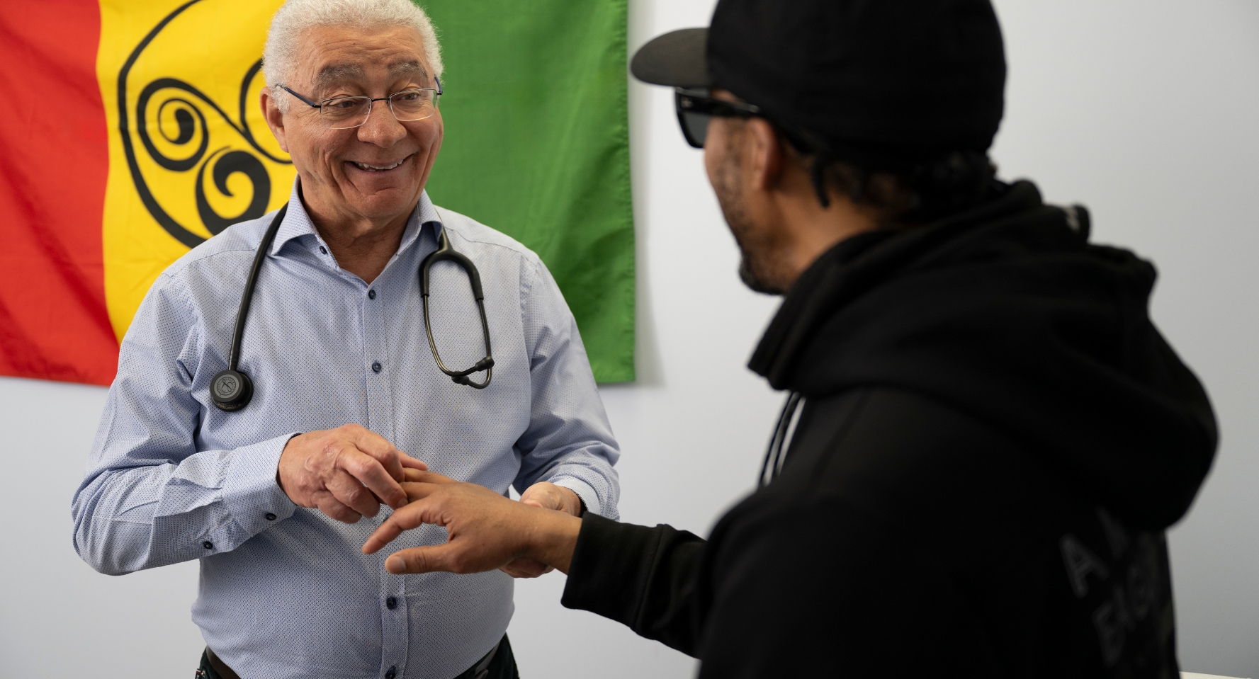 Dr. Ron Milne attends to a patient in his office